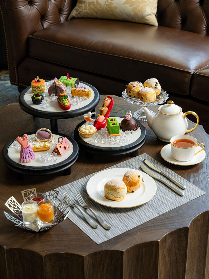 Afternoon tea spread with pastries and tea set