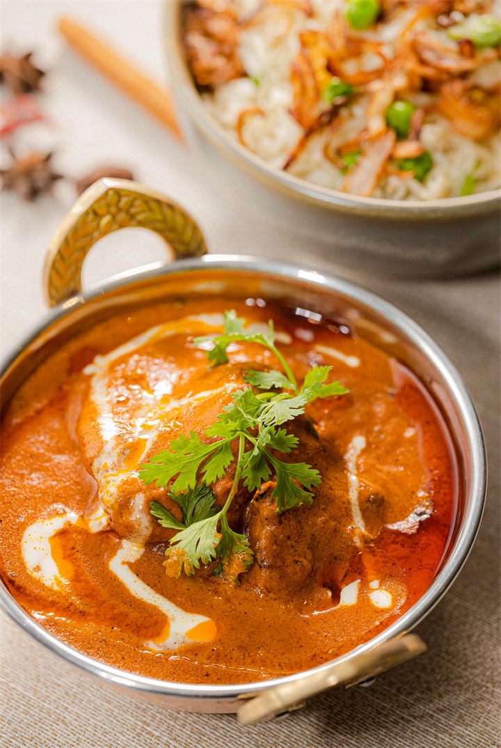 Butter chicken in a copper bowl, food photography in Dubai